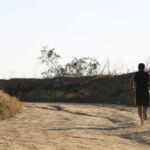 man_running_on_dirt_path_596144